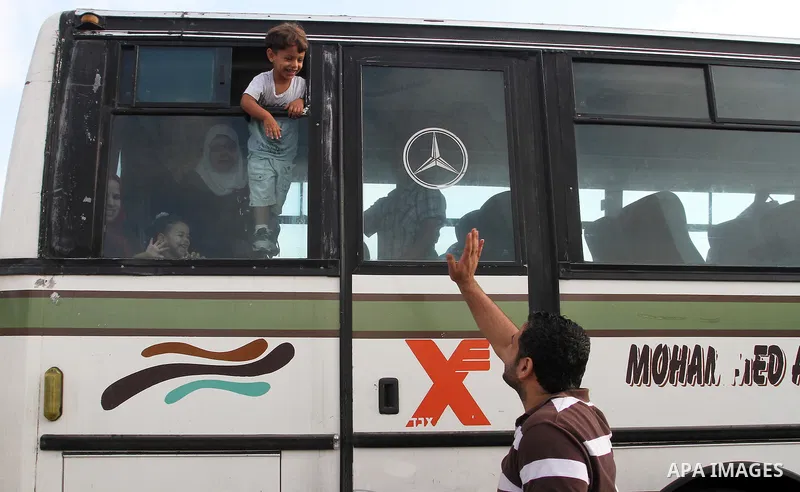 Palestinians wait for travel permits to cross into Egypt through the Rafah border crossing on October 16, 2016 in the southern Gaza Strip. Egyptian authorities temporarily reopened the crossing both directions for two da...