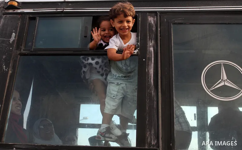 Palestinians wait for travel permits to cross into Egypt through the Rafah border crossing on October 16, 2016 in the southern Gaza Strip. Egyptian authorities temporarily reopened the crossing both directions for two da...