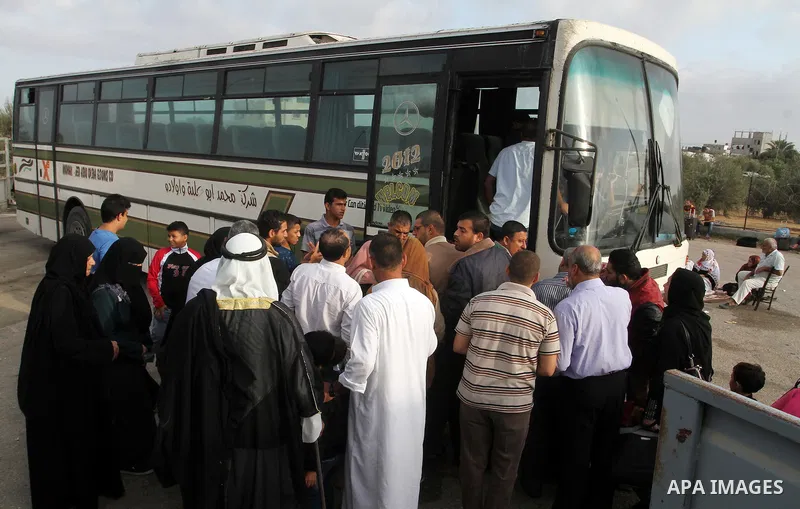 Palestinians wait for travel permits to cross into Egypt through the Rafah border crossing on October 16, 2016 in the southern Gaza Strip. Egyptian authorities temporarily reopened the crossing both directions for two da...