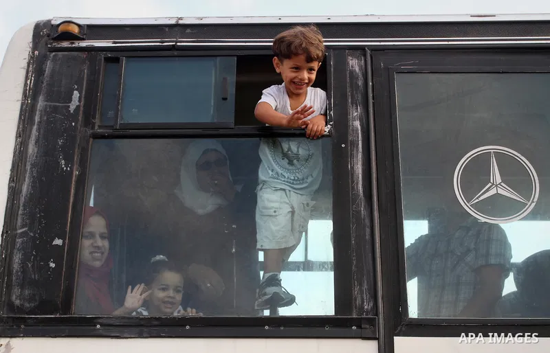 Palestinians wait for travel permits to cross into Egypt through the Rafah border crossing on October 16, 2016 in the southern Gaza Strip. Egyptian authorities temporarily reopened the crossing both directions for two da...