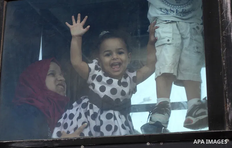 Palestinians wait for travel permits to cross into Egypt through the Rafah border crossing on October 16, 2016 in the southern Gaza Strip. Egyptian authorities temporarily reopened the crossing both directions for two da...