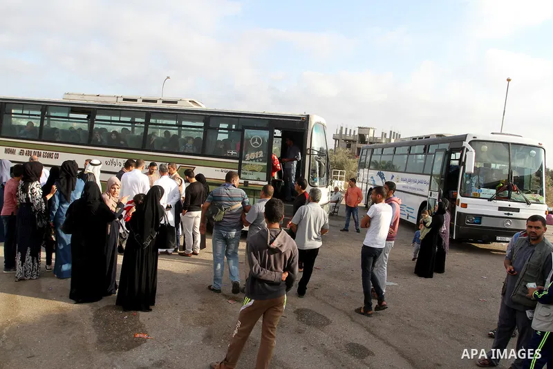 Palestinians wait for travel permits to cross into Egypt through the Rafah border crossing on October 16, 2016 in the southern Gaza Strip. Egyptian authorities temporarily reopened the crossing both directions for two da...