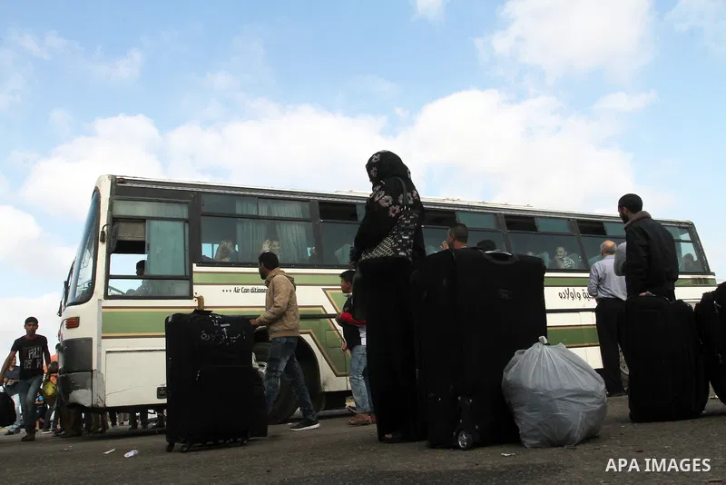 Palestinians wait for travel permits to cross into Egypt through the Rafah border crossing on October 16, 2016 in the southern Gaza Strip. Egyptian authorities temporarily reopened the crossing both directions for two da...