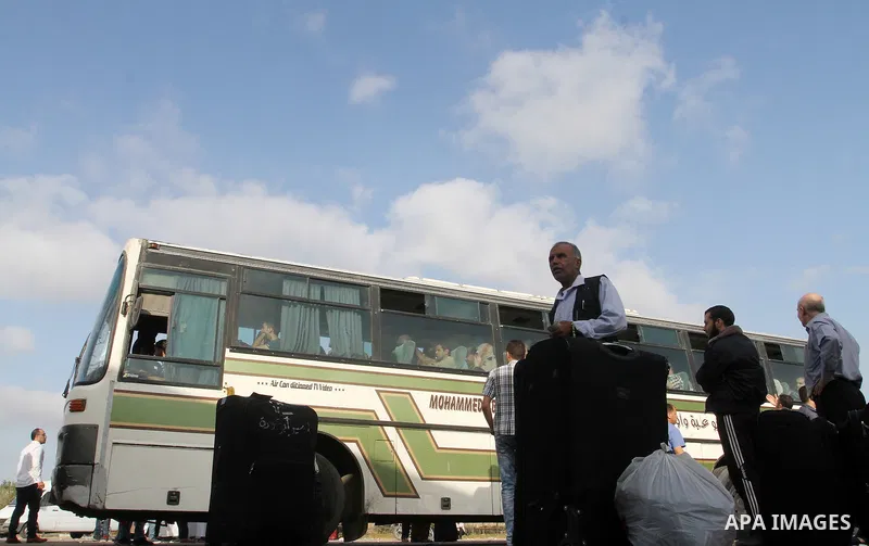 Palestinians wait for travel permits to cross into Egypt through the Rafah border crossing on October 16, 2016 in the southern Gaza Strip. Egyptian authorities temporarily reopened the crossing both directions for two da...