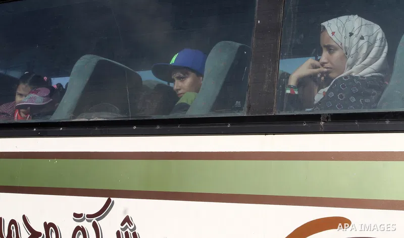 Palestinians wait for travel permits to cross into Egypt through the Rafah border crossing on October 16, 2016 in the southern Gaza Strip. Egyptian authorities temporarily reopened the crossing both directions for two da...