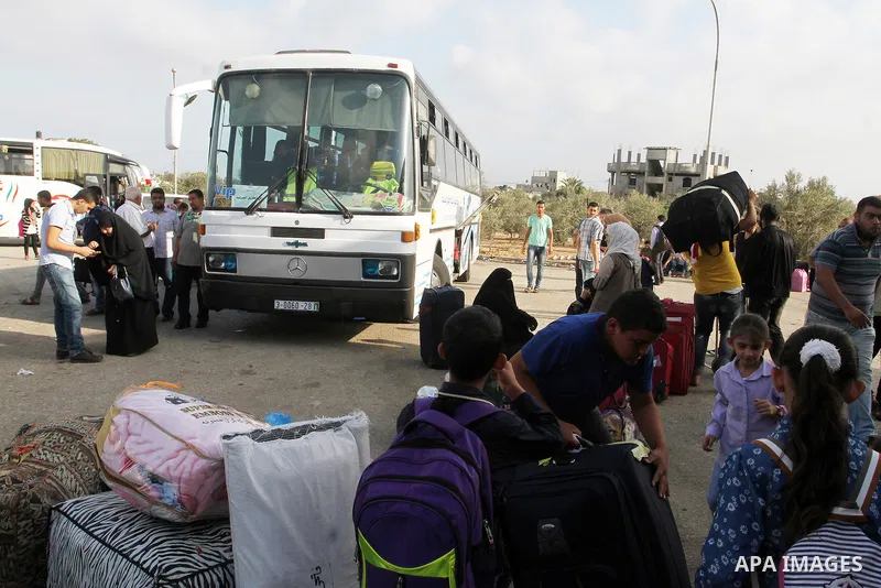 Palestinians wait for travel permits to cross into Egypt through the Rafah border crossing on October 16, 2016 in the southern Gaza Strip. Egyptian authorities temporarily reopened the crossing both directions for two da...