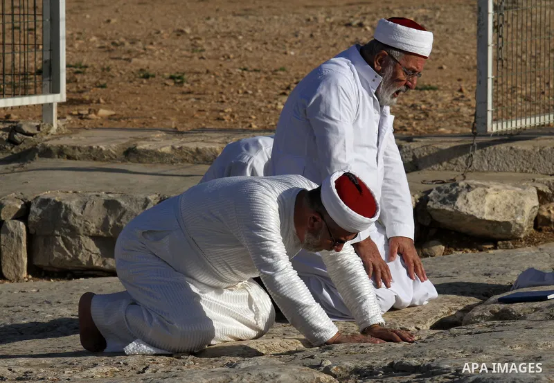 Samaritans pray on top of Mount Gerizim near the northern West Bank city of Nablus on October 17, 2016 during Sukkot (Tabernacles) celebrations. Sukkot marks the exodus of the ancient Hebrew people from Egypt. The Samari...