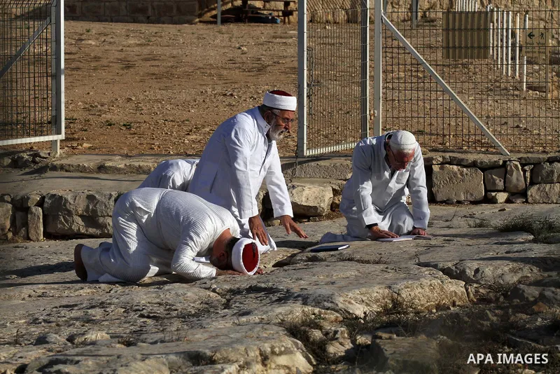 Samaritans pray on top of Mount Gerizim near the northern West Bank city of Nablus on October 17, 2016 during Sukkot (Tabernacles) celebrations. Sukkot marks the exodus of the ancient Hebrew people from Egypt. The Samari...