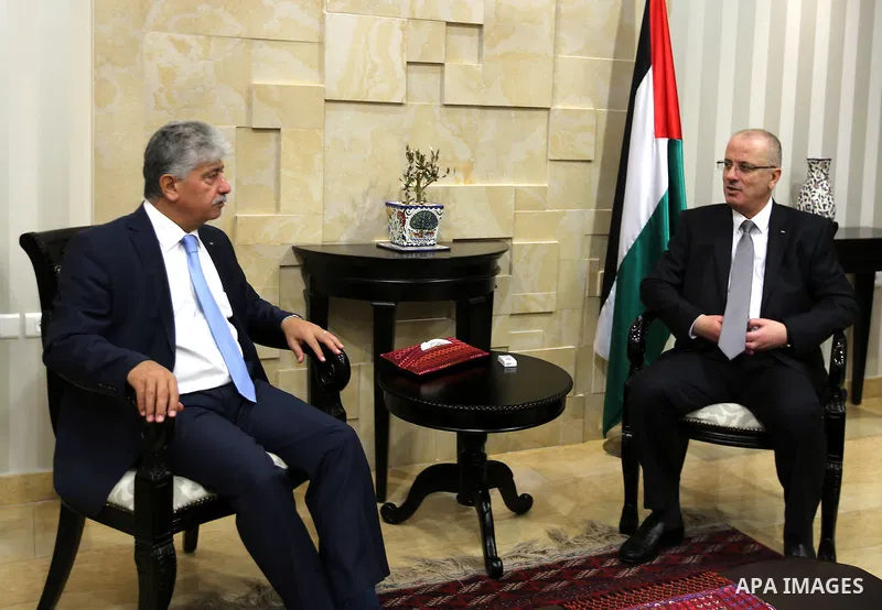 Palestinian Prime Minister Rami hamdallah meets with head of the Palestinian Authority retirement, Dr. Ahmed Majdalani, in the West Bank city of Ramallah on October 19, 2016. Photo by Prime Minister Office