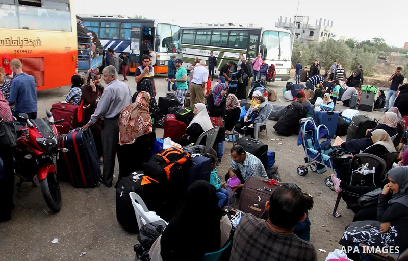 Palestinians wait for travel permits to cross into Egypt through the Rafah border crossing after it was opened by Egyptian authorities for humanitarian cases, in Rafah in the southern Gaza Strip October 19, 2016. Photo b...