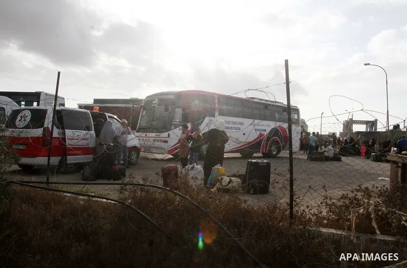 Palestinians wait for travel permits to cross into Egypt through the Rafah border crossing after it was opened by Egyptian authorities for humanitarian cases, in Rafah in the southern Gaza Strip October 19, 2016. Photo b...
