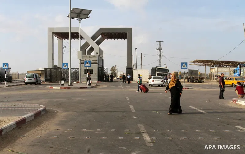 Palestinians wait for travel permits to cross into Egypt through the Rafah border crossing after it was opened by Egyptian authorities for humanitarian cases, in Rafah in the southern Gaza Strip October 19, 2016. Photo b...