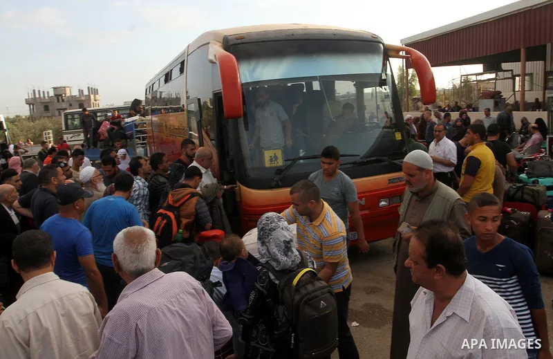 Palestinians wait for travel permits to cross into Egypt through the Rafah border crossing after it was opened by Egyptian authorities for humanitarian cases, in Rafah in the southern Gaza Strip October 19, 2016. Photo b...
