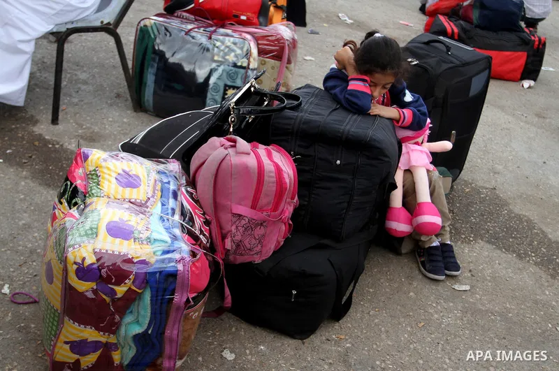 Palestinians wait for travel permits to cross into Egypt through the Rafah border crossing after it was opened by Egyptian authorities for humanitarian cases, in Rafah in the southern Gaza Strip October 19, 2016. Photo b...