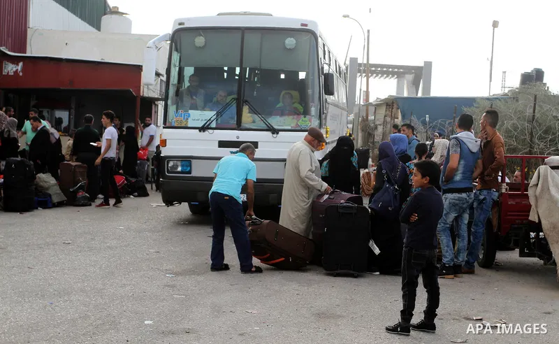 Palestinians wait for travel permits to cross into Egypt through the Rafah border crossing after it was opened by Egyptian authorities for humanitarian cases, in Rafah in the southern Gaza Strip October 19, 2016. Photo b...