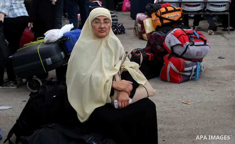 Palestinians wait for travel permits to cross into Egypt through the Rafah border crossing after it was opened by Egyptian authorities for humanitarian cases, in Rafah in the southern Gaza Strip October 19, 2016. Photo b...