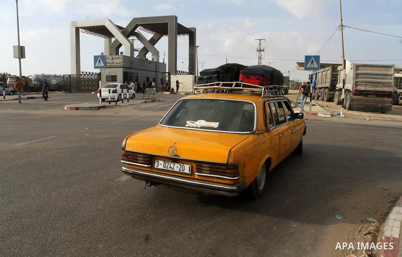 Palestinians wait for travel permits to cross into Egypt through the Rafah border crossing after it was opened by Egyptian authorities for humanitarian cases, in Rafah in the southern Gaza Strip October 19, 2016. Photo b...