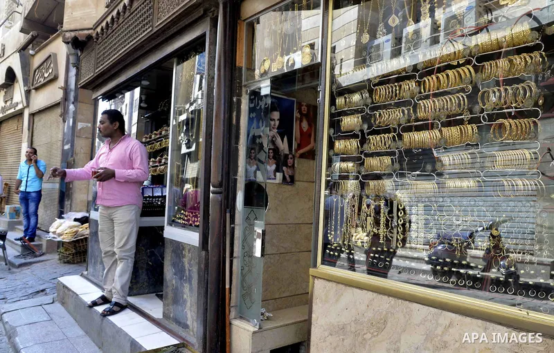 An Egyptian vendor stands outside his jewellery store, in cairo, Egypy, on October 19, 2016. Decline in demand for gold in the Egyptian markets due to the high price. Photo by Amr Sayed