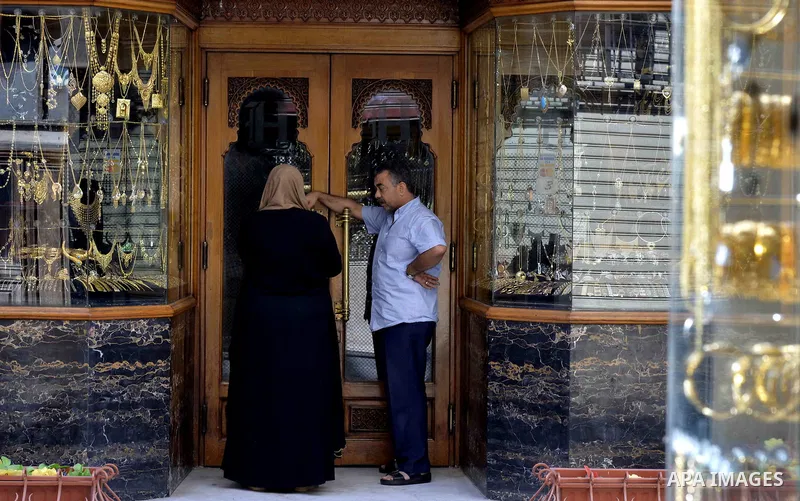 An Egyptian vendor stands outside his jewellery store, in cairo, Egypy, on October 19, 2016. Decline in demand for gold in the Egyptian markets due to the high price. Photo by Amr Sayed
