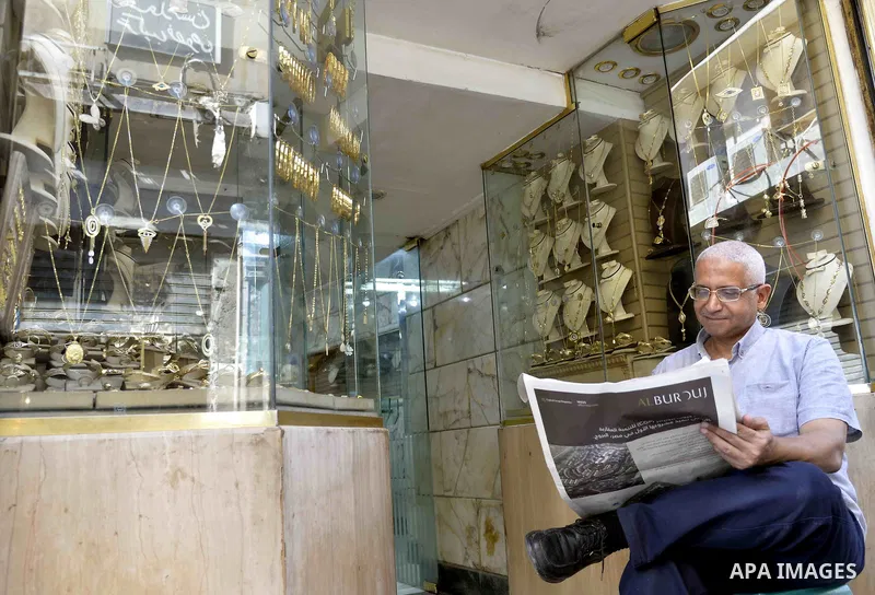 An Egyptian vendor sits outside his jewellery store, in cairo, Egypy, on October 19, 2016. Decline in demand for gold in the Egyptian markets due to the high price. Photo by Amr Sayed