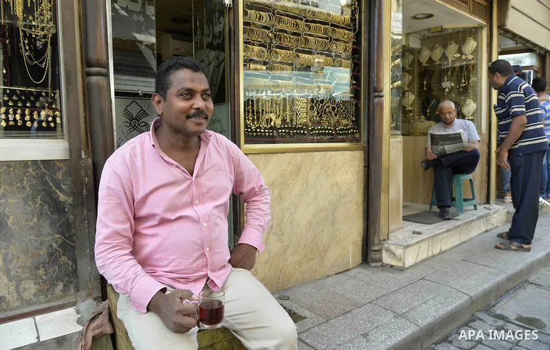 An Egyptian vendor sits outside his jewellery store, in cairo, Egypy, on October 19, 2016. Decline in demand for gold in the Egyptian markets due to the high price. Photo by Amr Sayed