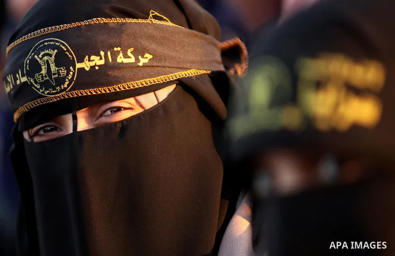 A Palestinian woman supporting Islamic Jihad attends a military parade marking the 29 anniversary of their group in Gaza October 19, 2016. Photo by Ashraf Amra