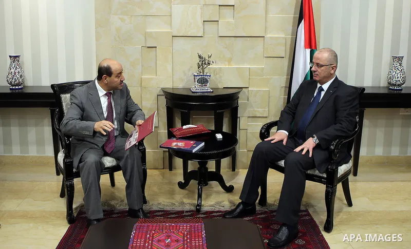 Palestinian Prime Minister, Rami Hamdallah, meets with head of the Bureau staff Moussa Abu Zaid, in the West Bank city of Ramallah, Oct. 20, 2016.. Photo by Prime Minister Office