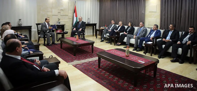 Palestinian Prime Minister, Rami Hamdallah, meets with head of the Bureau staff Moussa Abu Zaid, in the West Bank city of Ramallah, Oct. 20, 2016.. Photo by Prime Minister Office