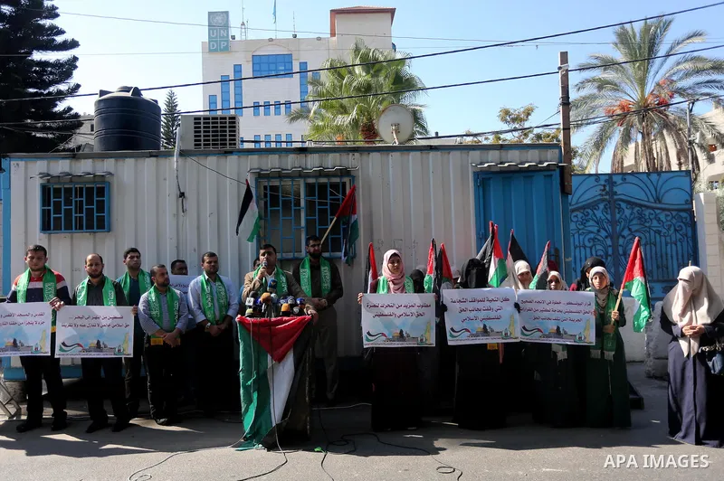 Palestinian Hamas supporters take part in a rally in support of the decision of UNESCO on the Al-Aqsa Mosque in front of the headquarter United Nation "UNSCO", in Gaza city, on October 20, 2016. Palestinian leaders have...