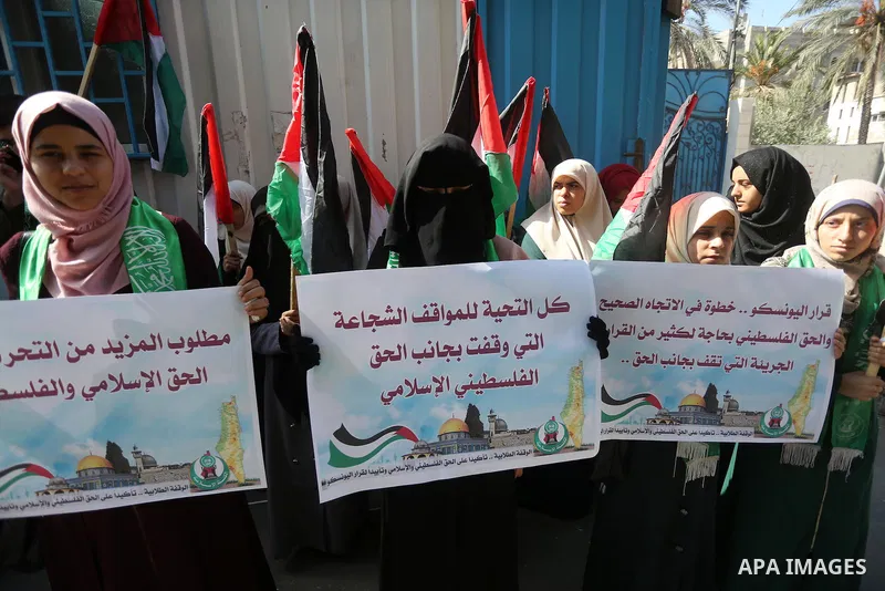 Palestinian Hamas supporters take part in a rally in support of the decision of UNESCO on the Al-Aqsa Mosque in front of the headquarter United Nation "UNSCO", in Gaza city, on October 20, 2016. Palestinian leaders have...