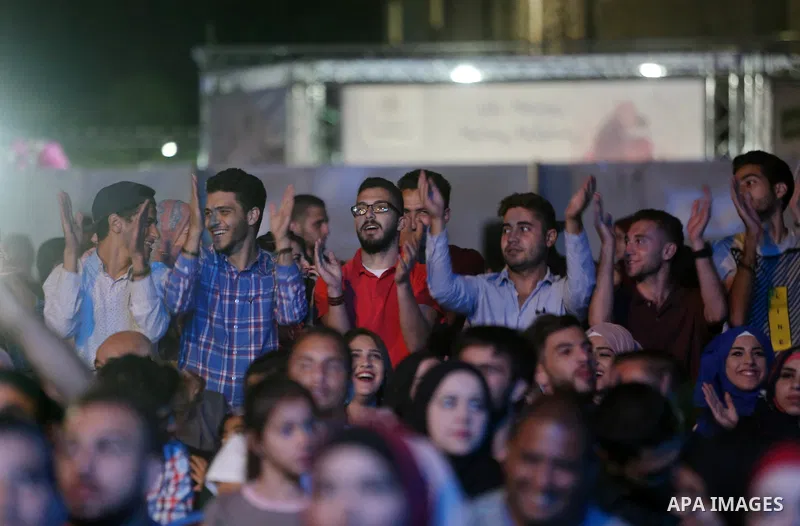 Palestinians attend the Birzeit Nights Festival at Birzeit University in the West Bank city of Ramallah on Oct. 20, 2016. Photo by Shadi Hatem