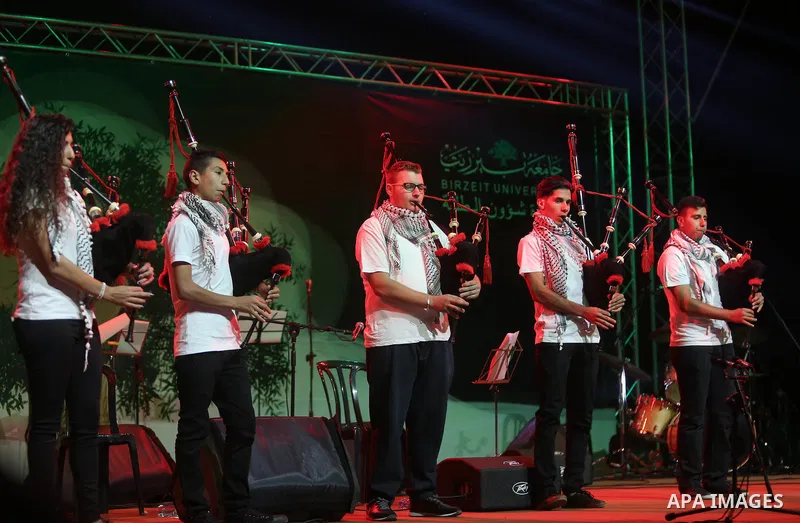 Palestinian youths perform during the Birzeit Nights Festival at Birzeit University in the West Bank city of Ramallah on Oct. 20, 2016. Photo by Shadi Hatem