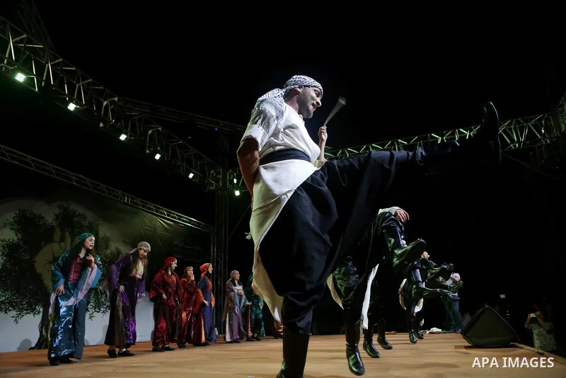 Members of Palestinian dance Dabka band perform during the Birzeit Nights Festival at Birzeit University in the West Bank city of Ramallah on Oct. 20, 2016. Photo by Shadi Hatem