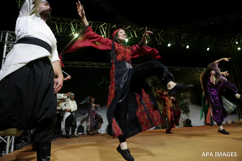 Members of Palestinian dance Dabka band perform during the Birzeit Nights Festival at Birzeit University in the West Bank city of Ramallah on Oct. 20, 2016. Photo by Shadi Hatem