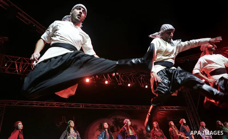 Members of Palestinian dance Dabka band perform during the Birzeit Nights Festival at Birzeit University in the West Bank city of Ramallah on Oct. 20, 2016. Photo by Shadi Hatem