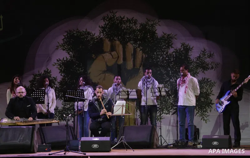 Palestinian youths perform during the Birzeit Nights Festival at Birzeit University in the West Bank city of Ramallah on Oct. 20, 2016. Photo by Shadi Hatem