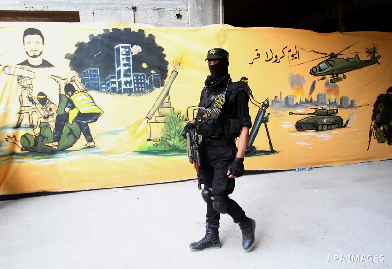 A Palestinian Islamic Jihad militant stands guard during a rally marking the 29th anniversary of the movement foundation in Gaza City October 21, 2016. Photo by Abed Rahim Khatib