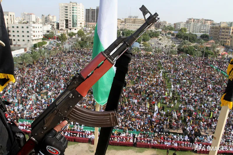 A Palestinian Islamic Jihad militant stands guard on a roof during a rally marking the 29th anniversary of the movement foundation in Gaza City October 21, 2016. Photo by Abed Rahim Khatib