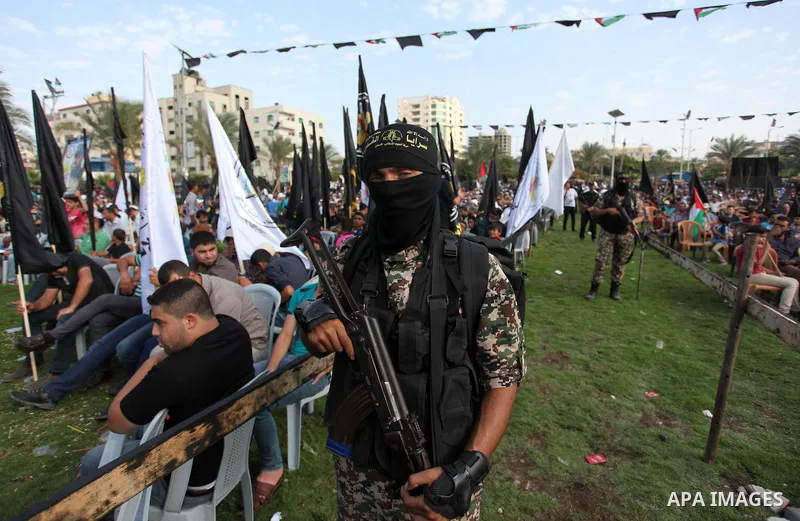 Palestinian Islamic Jihad militants stand guard during a rally marking the 29th anniversary of the movement foundation in Gaza City October 21, 2016. Photo by Ashraf Amra