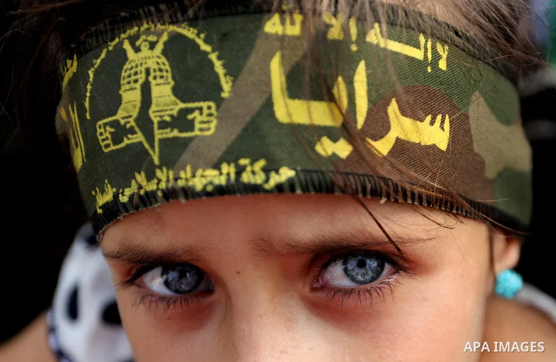 A Palestinian girl attends a rally marking the 29th anniversary of the foundation of the Islamic Jihad movement in Gaza City October 21, 2016. Photo by Ashraf Amra