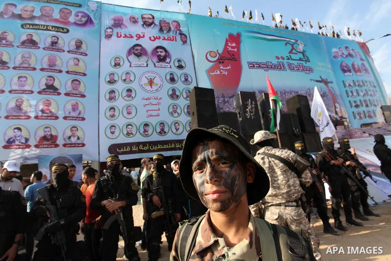 Palestinian Islamic Jihad militants stand guard during a rally marking the 29th anniversary of the movement foundation in Gaza City October 21, 2016. Photo by Ashraf Amra