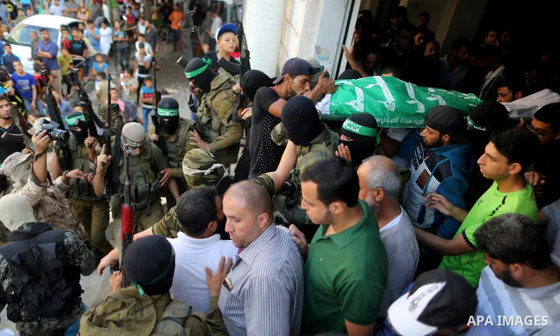 Palestinian members of the Ezzedine al-Qassam Brigades, the armed wing of the Hamas movement carry the body of a Palestinian fellow militant, Anas Salama Abu Lasheen, 22, who died after a tunnel collapse in the Gaza Stri...