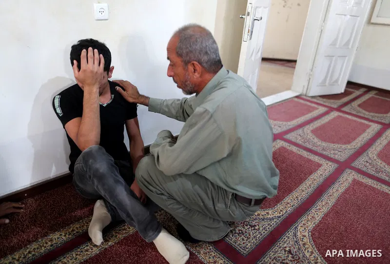 A relative of a Palestinian member of the Ezzedine al-Qassam Brigades, the armed wing of the Hamas Anas Salama Abu Lasheen, 22, who died after a tunnel collapse in the Gaza Strip mourns during his funeral, in the al-Magh...
