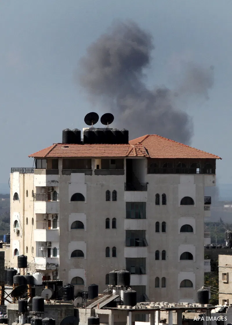 Smoke rises in Egypt's North Sinai as seen from the border of southern Gaza Strip with Egypt on Oct. 23, 2016. The Egyptian Air Force Sunday pounded jihadist groups in the Sinai Peninsula, reportedly killing 70 fighters...