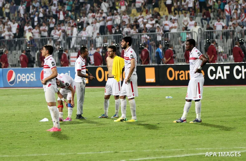 Zamalek's players react after losing the CAF Champions League football competition following the second round of the final match against South Africa's Mamelodi Sundowns on October 23, 2016 at the Borg el-Arab Stadium ne...