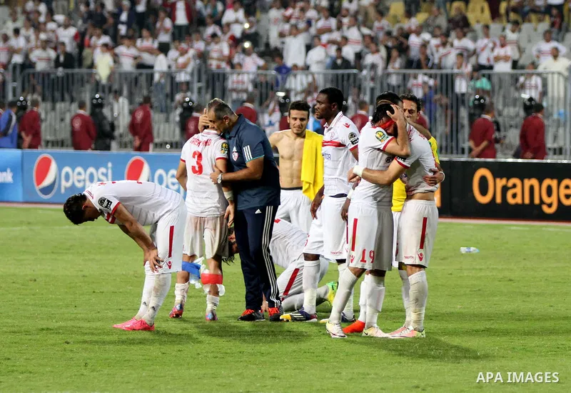 Zamalek's players react after losing the CAF Champions League football competition following the second round of the final match against South Africa's Mamelodi Sundowns on October 23, 2016 at the Borg el-Arab Stadium ne...