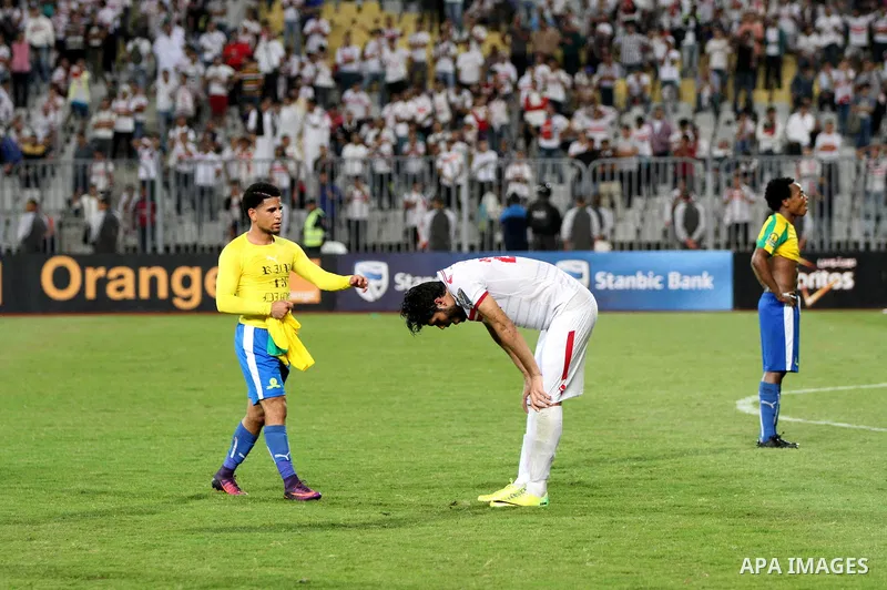 Zamalek's players react after losing the CAF Champions League football competition following the second round of the final match against South Africa's Mamelodi Sundowns on October 23, 2016 at the Borg el-Arab Stadium ne...