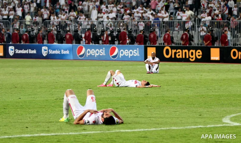 Zamalek's players react after losing the CAF Champions League football competition following the second round of the final match against South Africa's Mamelodi Sundowns on October 23, 2016 at the Borg el-Arab Stadium ne...