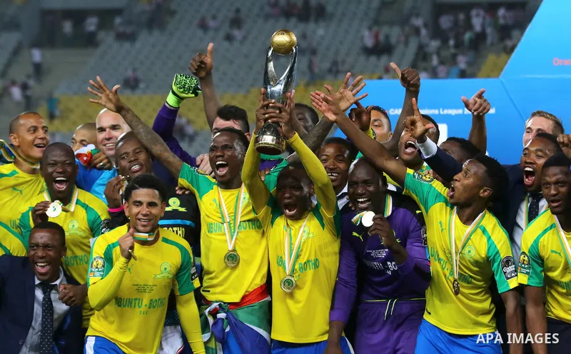 South Africa's Mamelodi Sundowns players celebrate after winning the CAF Champions League football competition following the final match against Egypt's Zamalek club on October 23, 2016 at the Borg el-Arab Stadium near A...