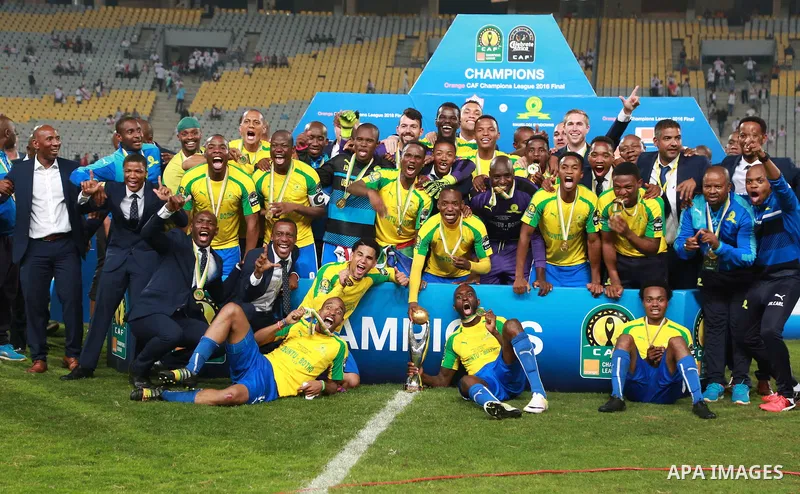 South Africa's Mamelodi Sundowns players celebrate after winning the CAF Champions League football competition following the final match against Egypt's Zamalek club on October 23, 2016 at the Borg el-Arab Stadium near A...